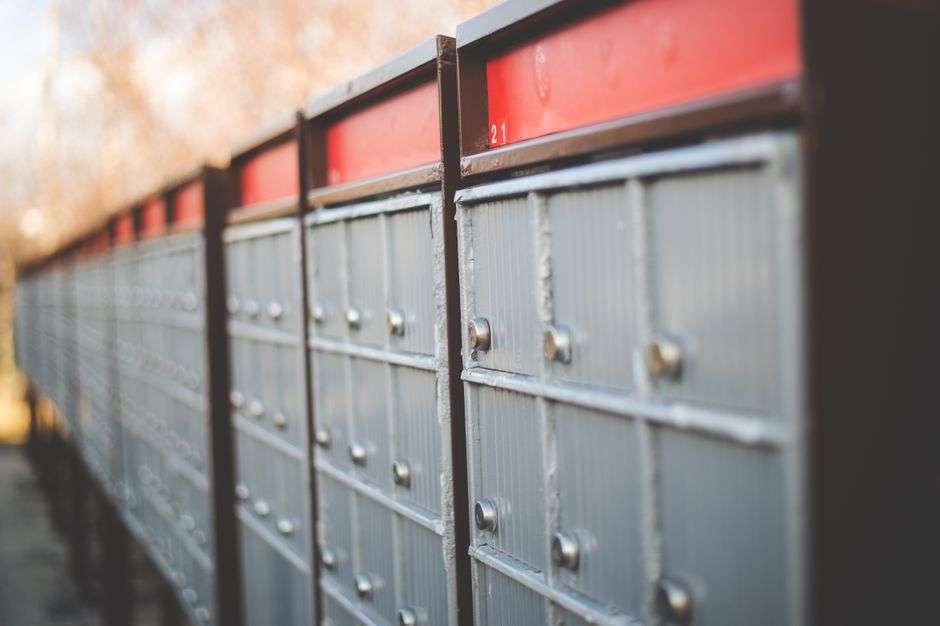 A row of residential mailboxes along a neighborhood street