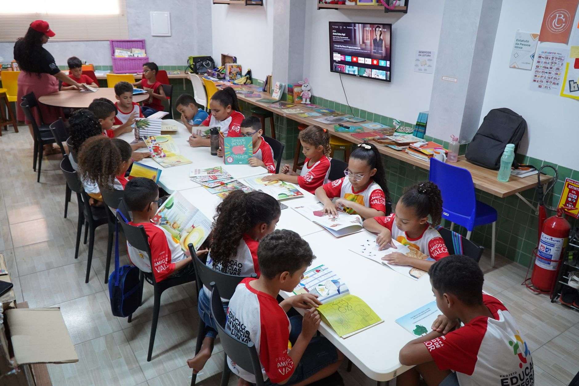 Children working on schoolwork and activities at an after-school program table
