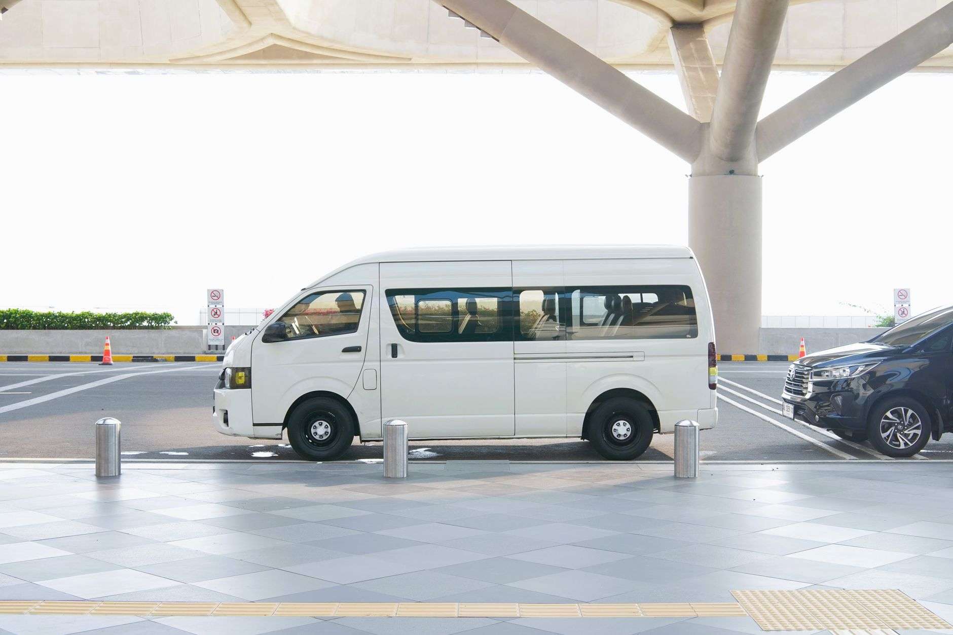 A passenger van on a city street representing on-demand microtransit service
