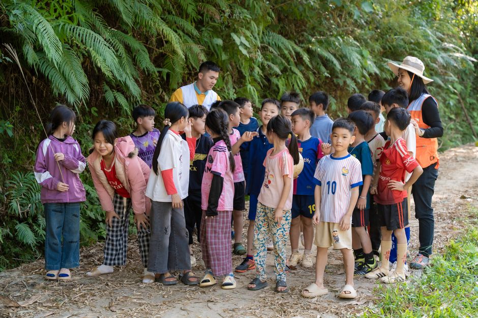 Families exploring nature exhibits at an outdoor community event