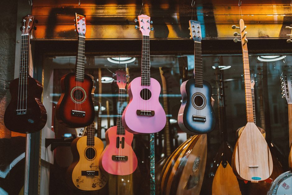 Acoustic guitars hanging on the wall of a music shop