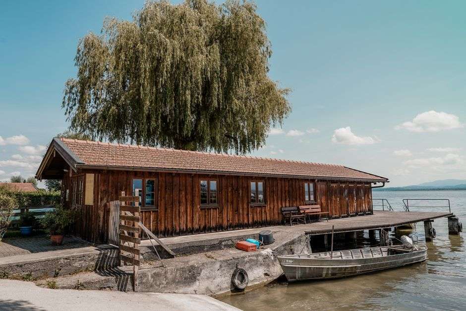 Rustic waterfront dive bar with a dock on a coastal bayou