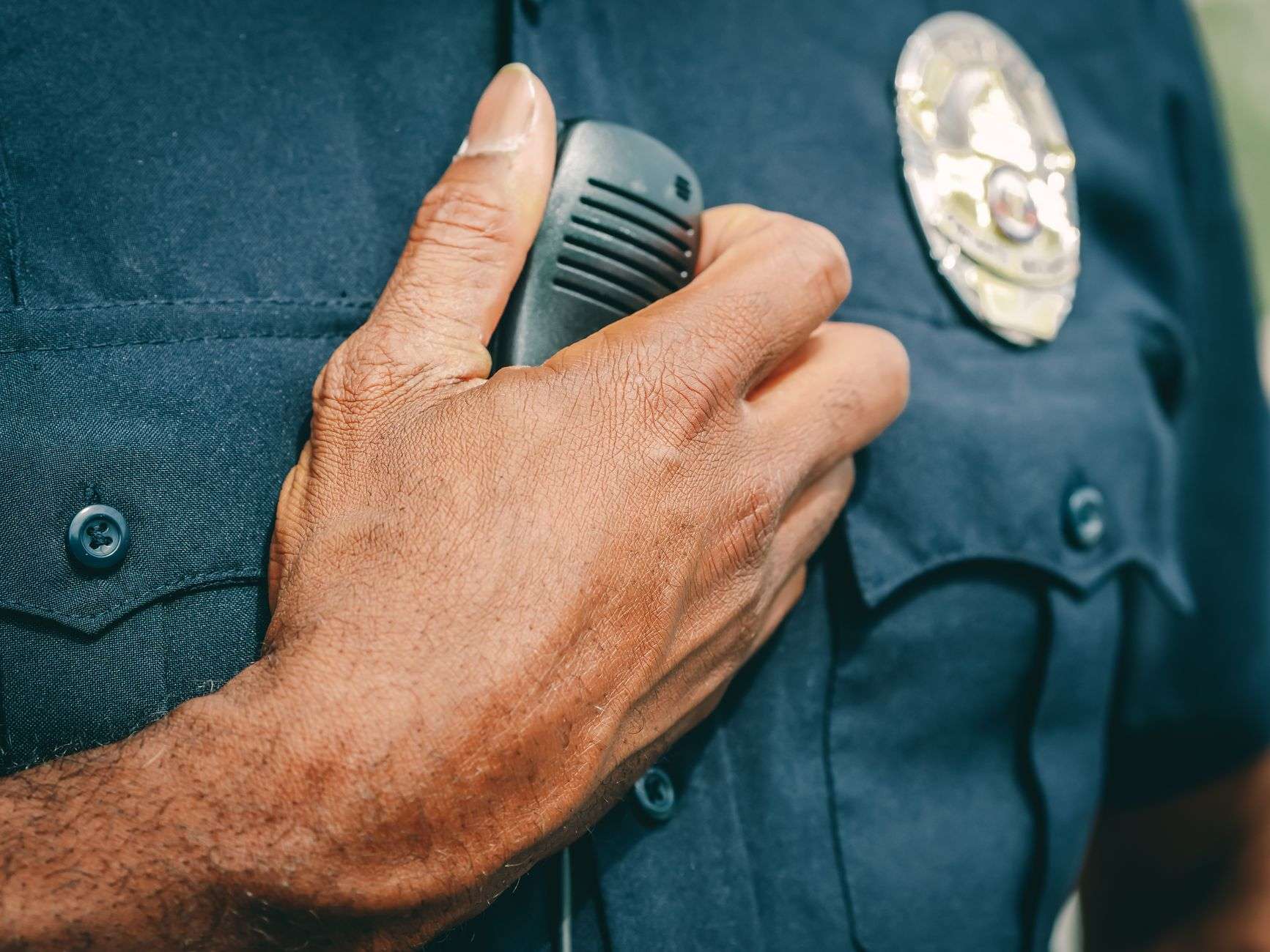 A police uniform and badge, illustrating recognition of long-serving law enforcement officers