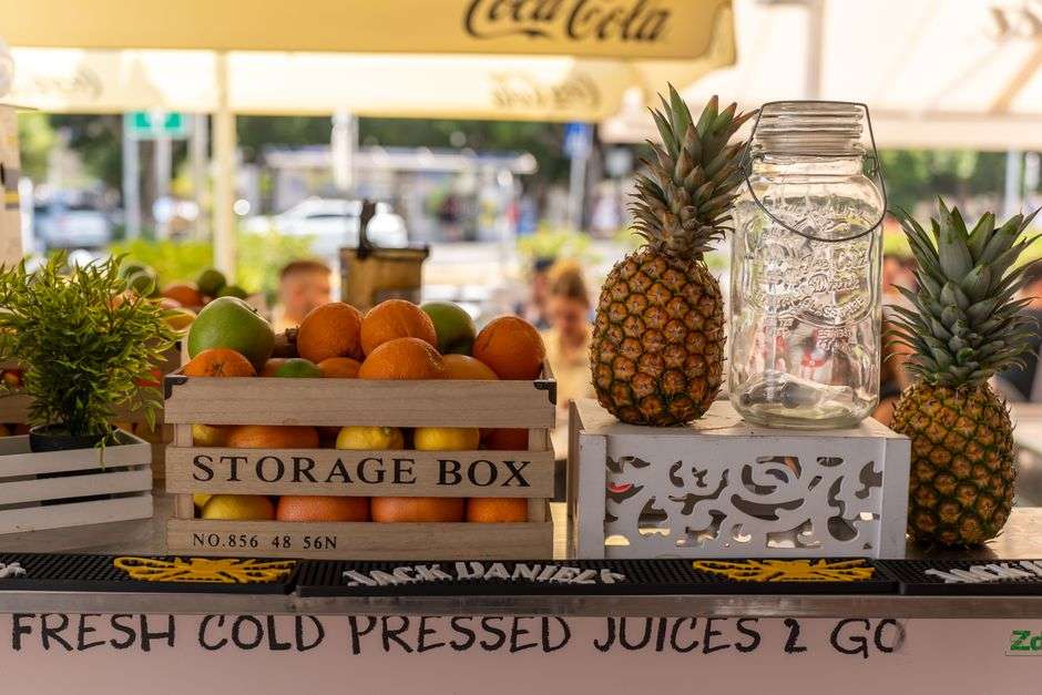 Fresh pressed juice and healthy dishes at a cafe counter