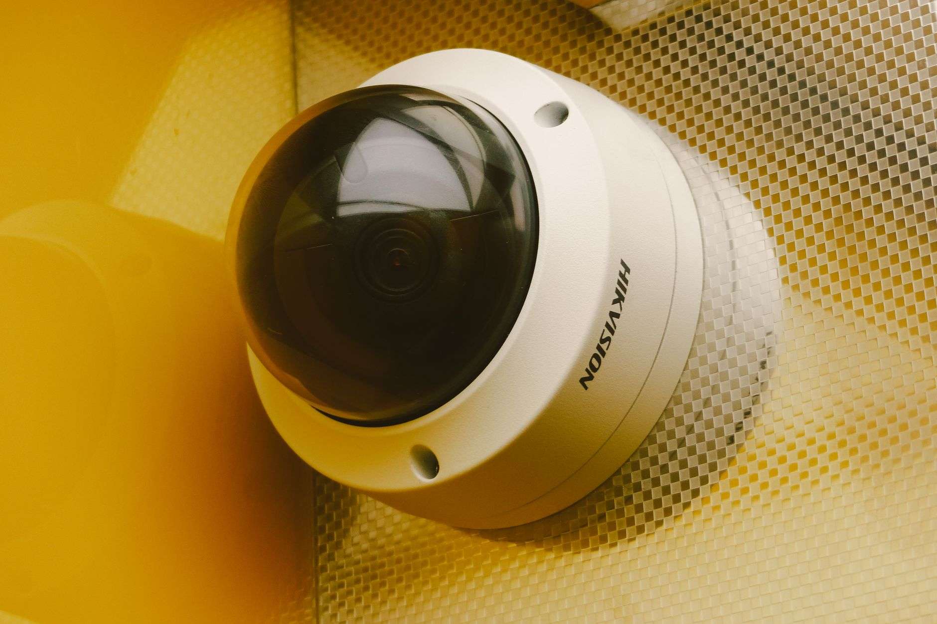 A security surveillance camera mounted on a ceiling