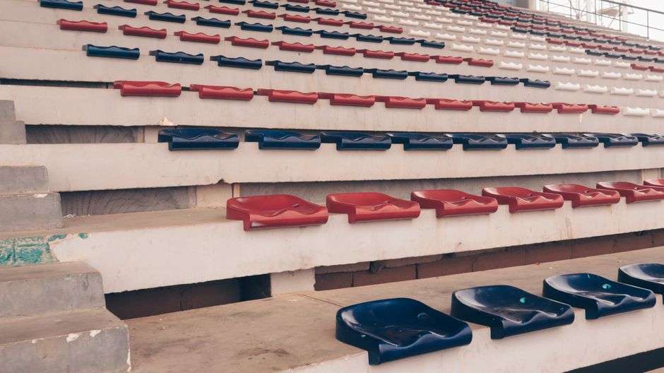 Empty bleachers at a high school football stadium