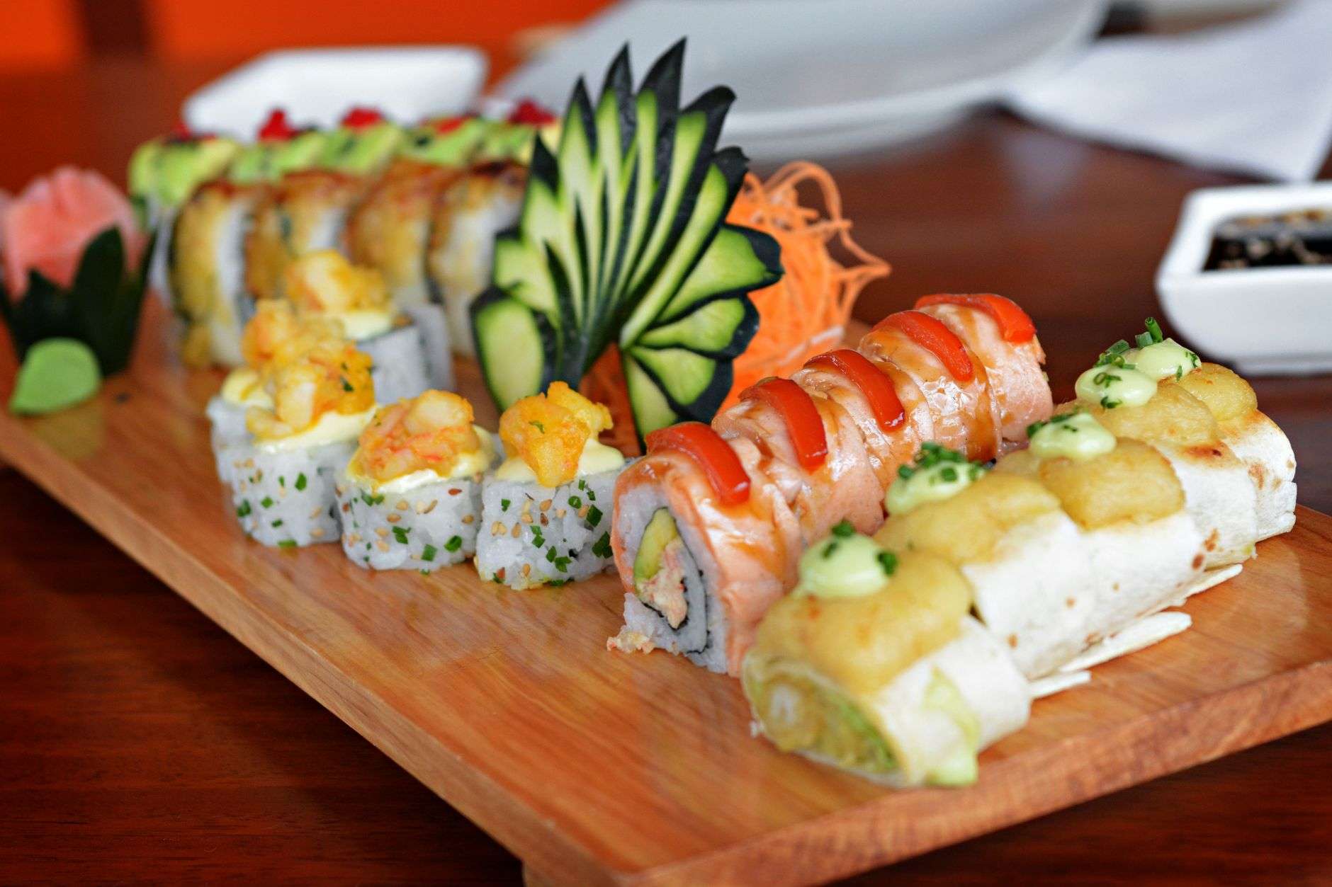 An assortment of sushi rolls arranged on a platter