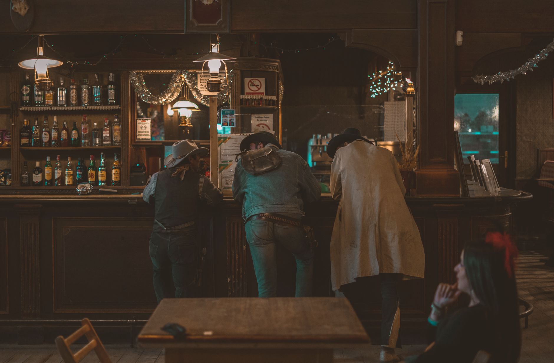 Interior of a rustic bar with heart pine wood and warm lighting