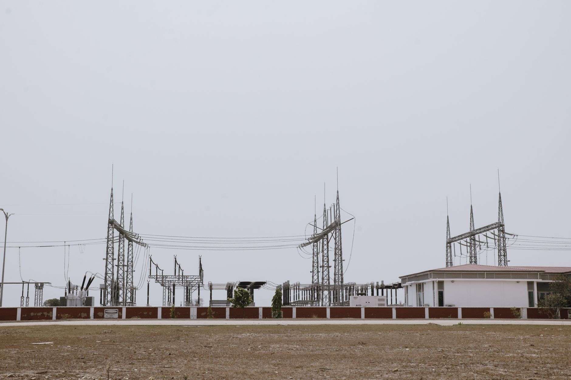 Electric power lines and utility poles against the sky