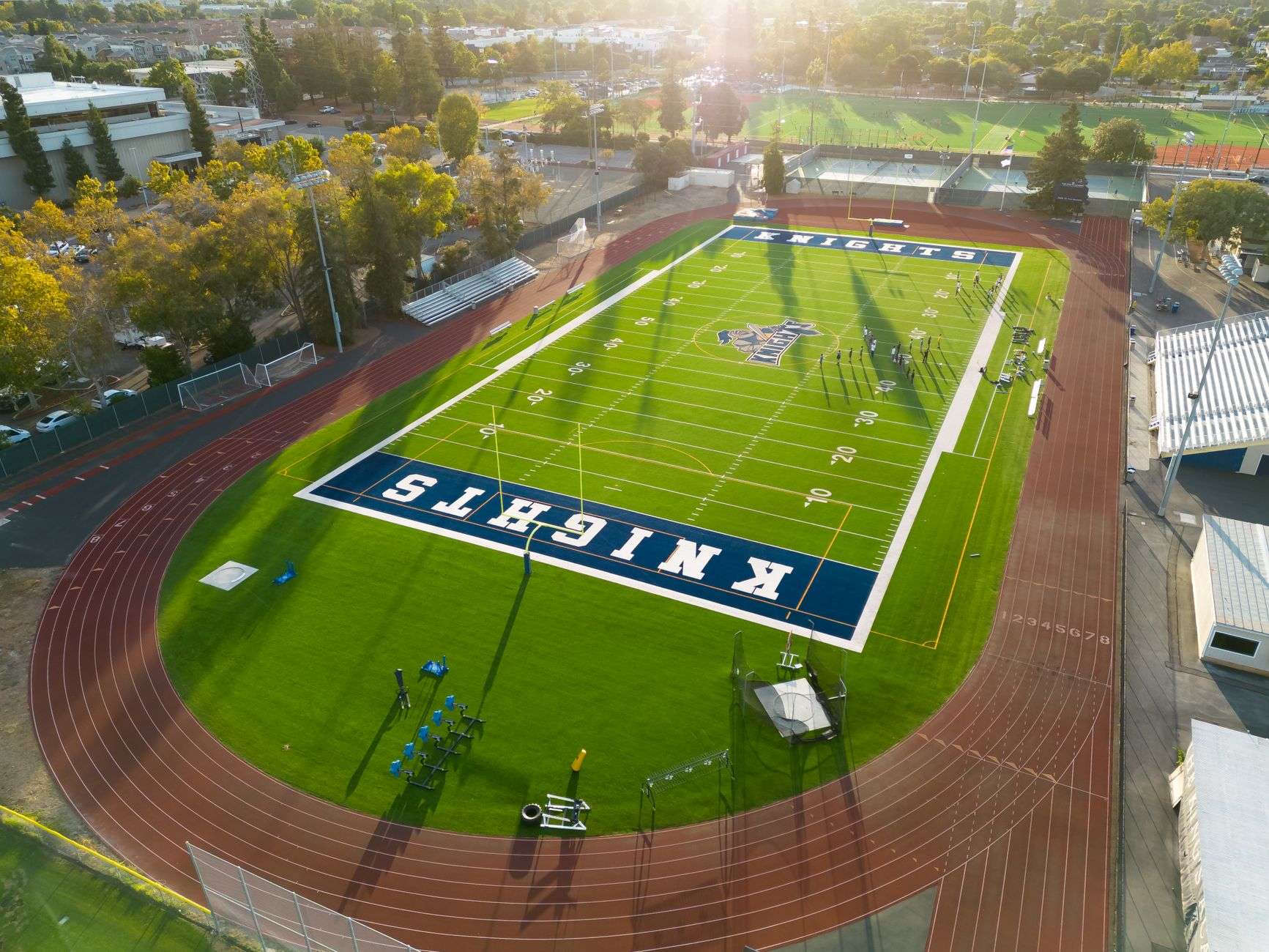 Empty high school football field with goal posts