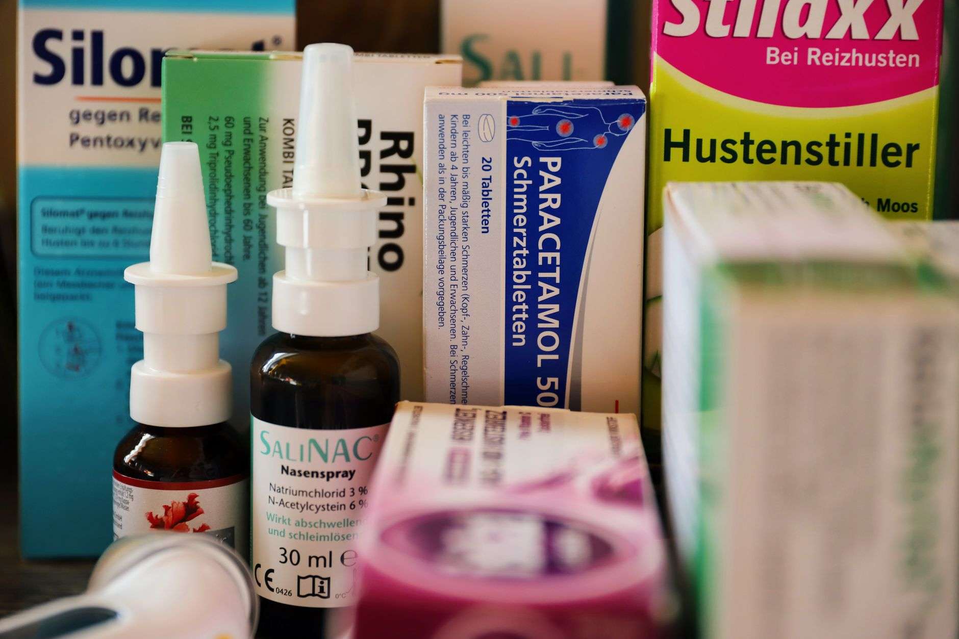 Assortment of medications on a pharmacy counter