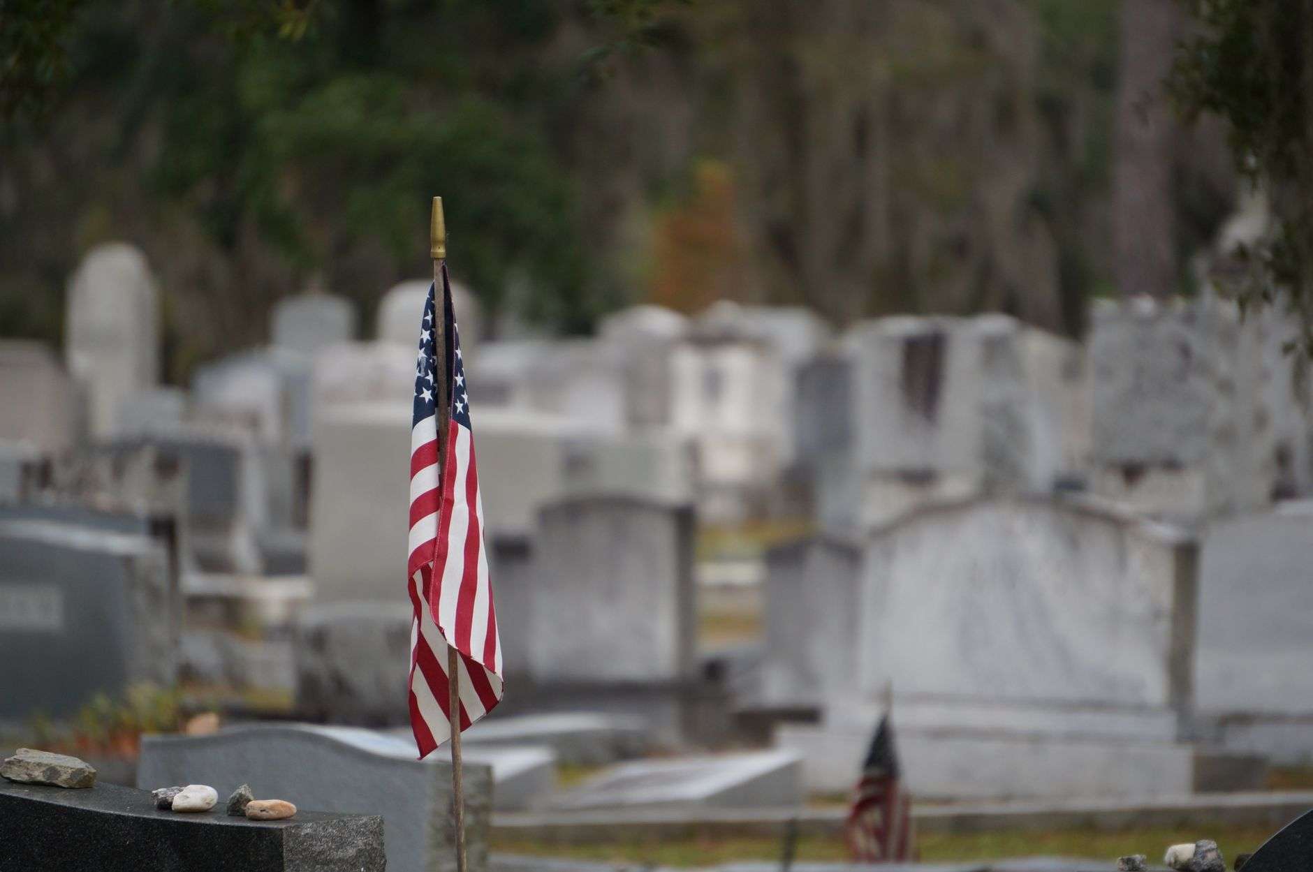 An American flag in a memorial setting, illustrating remembrance of the September 11 attacks