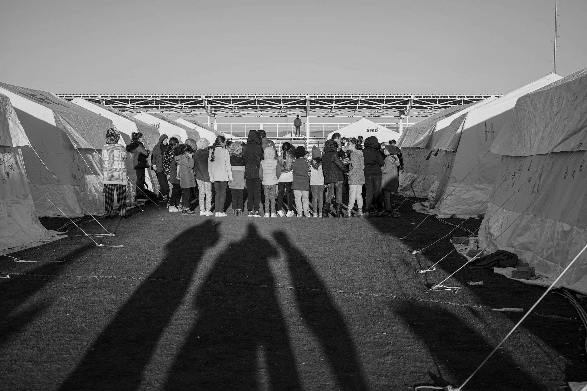 Tents and visitors at an outdoor beach festival