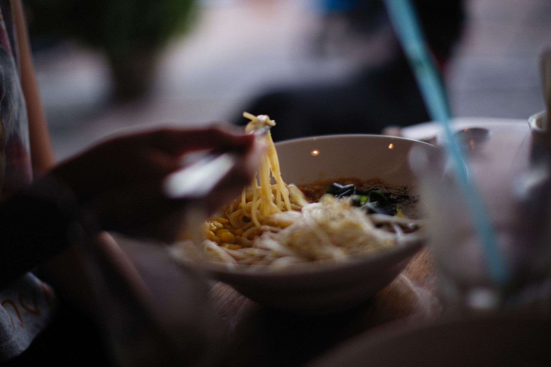 Bowl of ramen with noodles, egg and broth illustrating Slurp Society closing in downtown Mobile