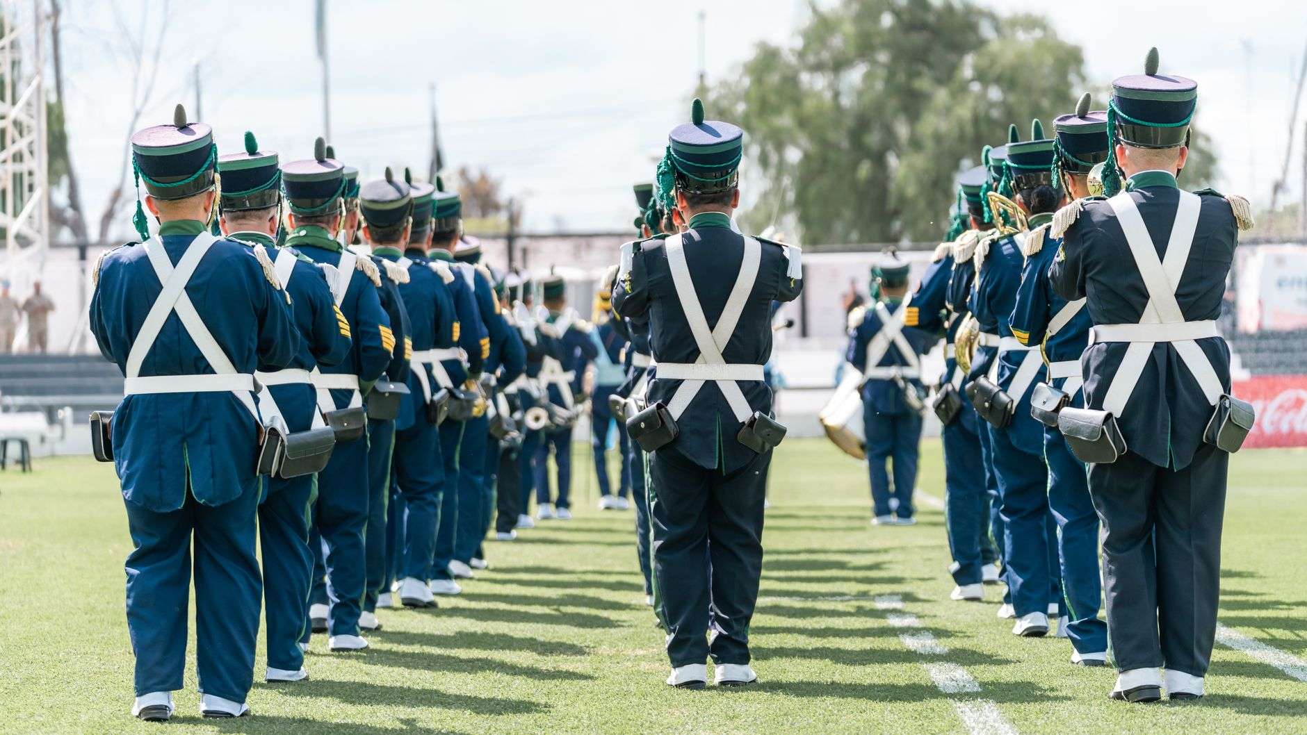 Marching band performing in formation on a field