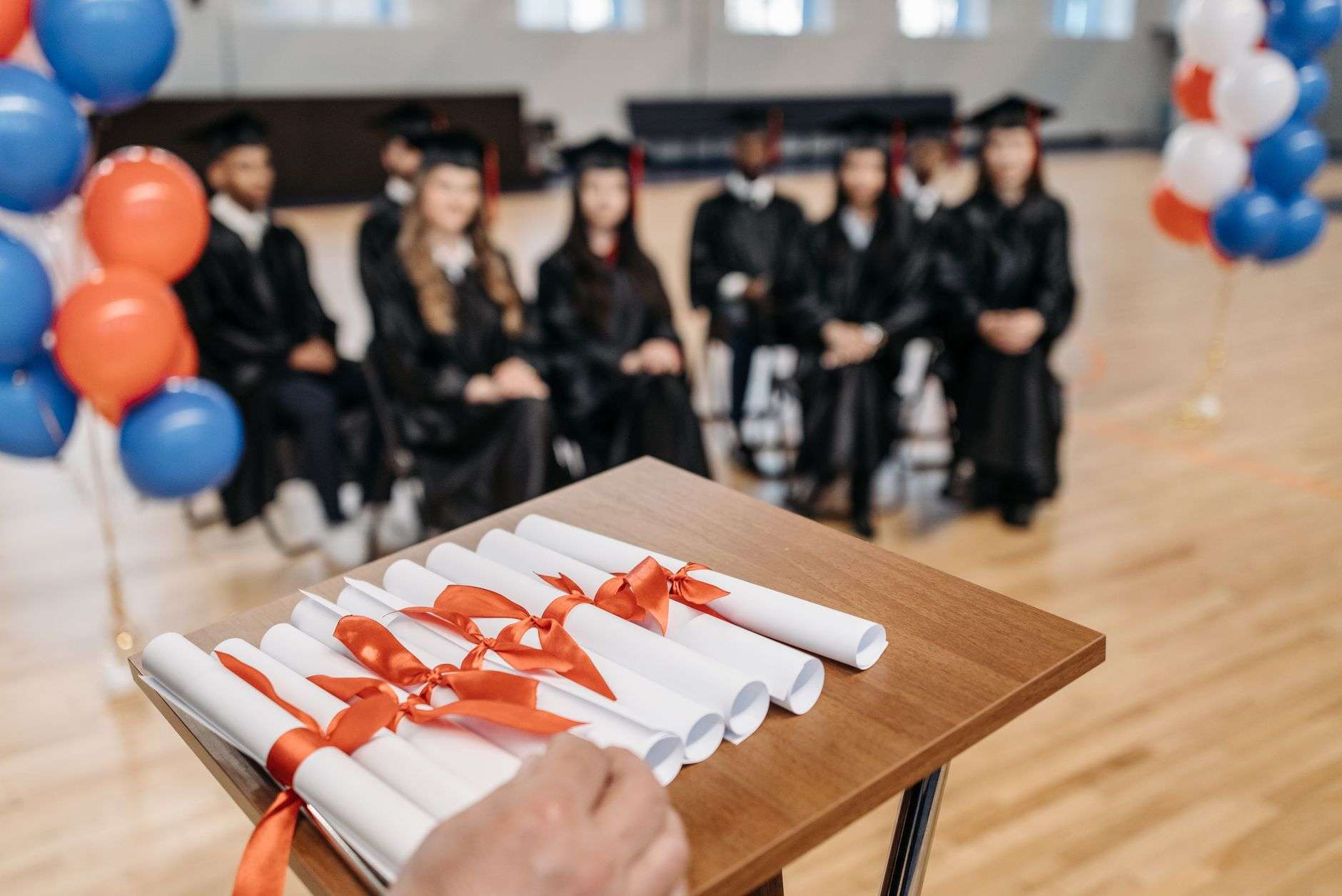 Graduation cap and books on a study desk