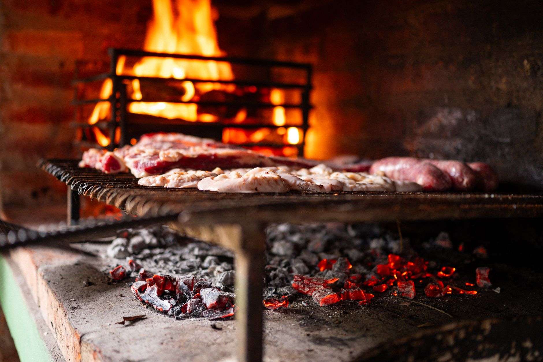 Smoke rising from a wood-fired barbecue smoker