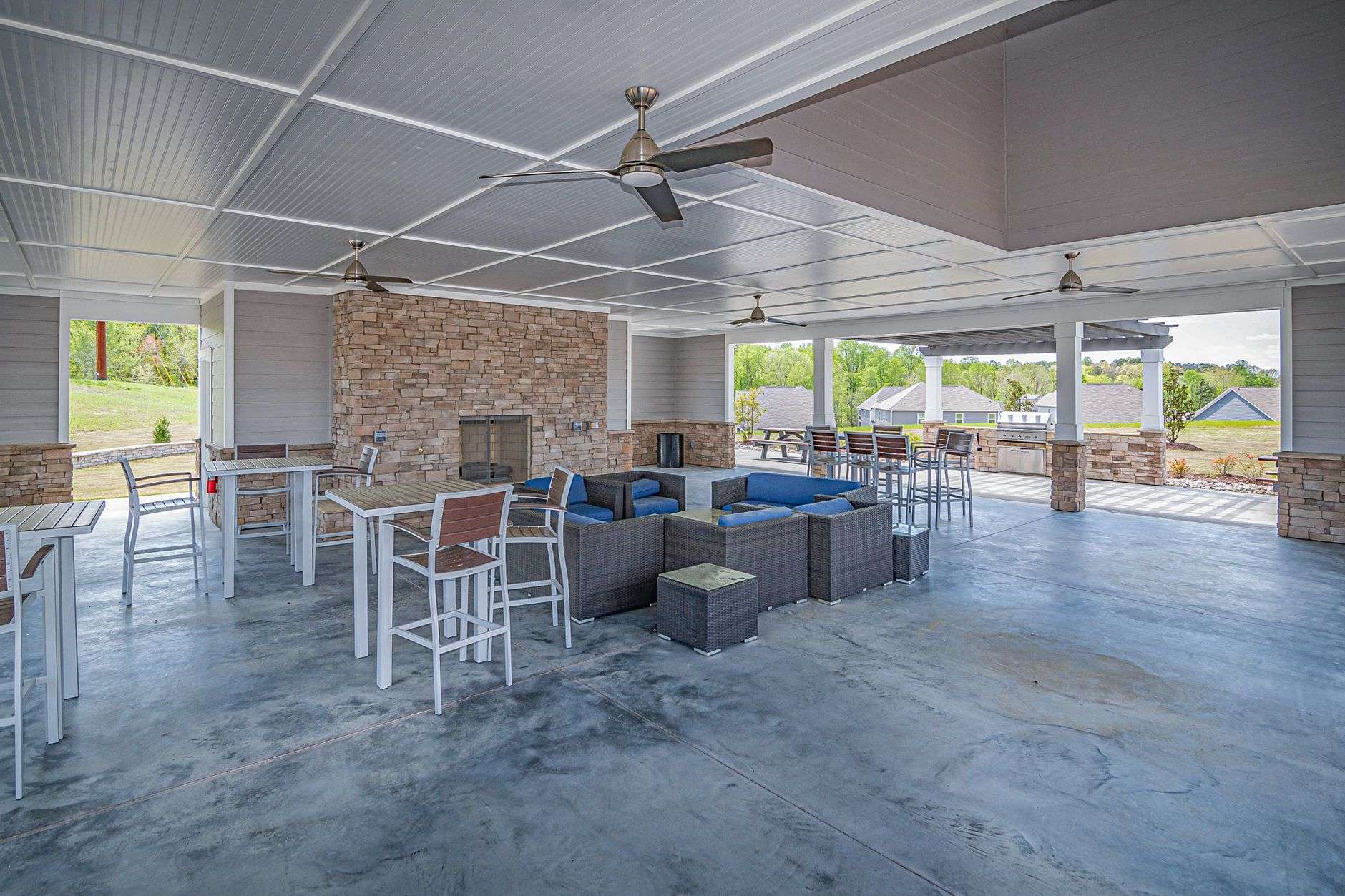 An outdoor patio bar surrounded by tropical plants