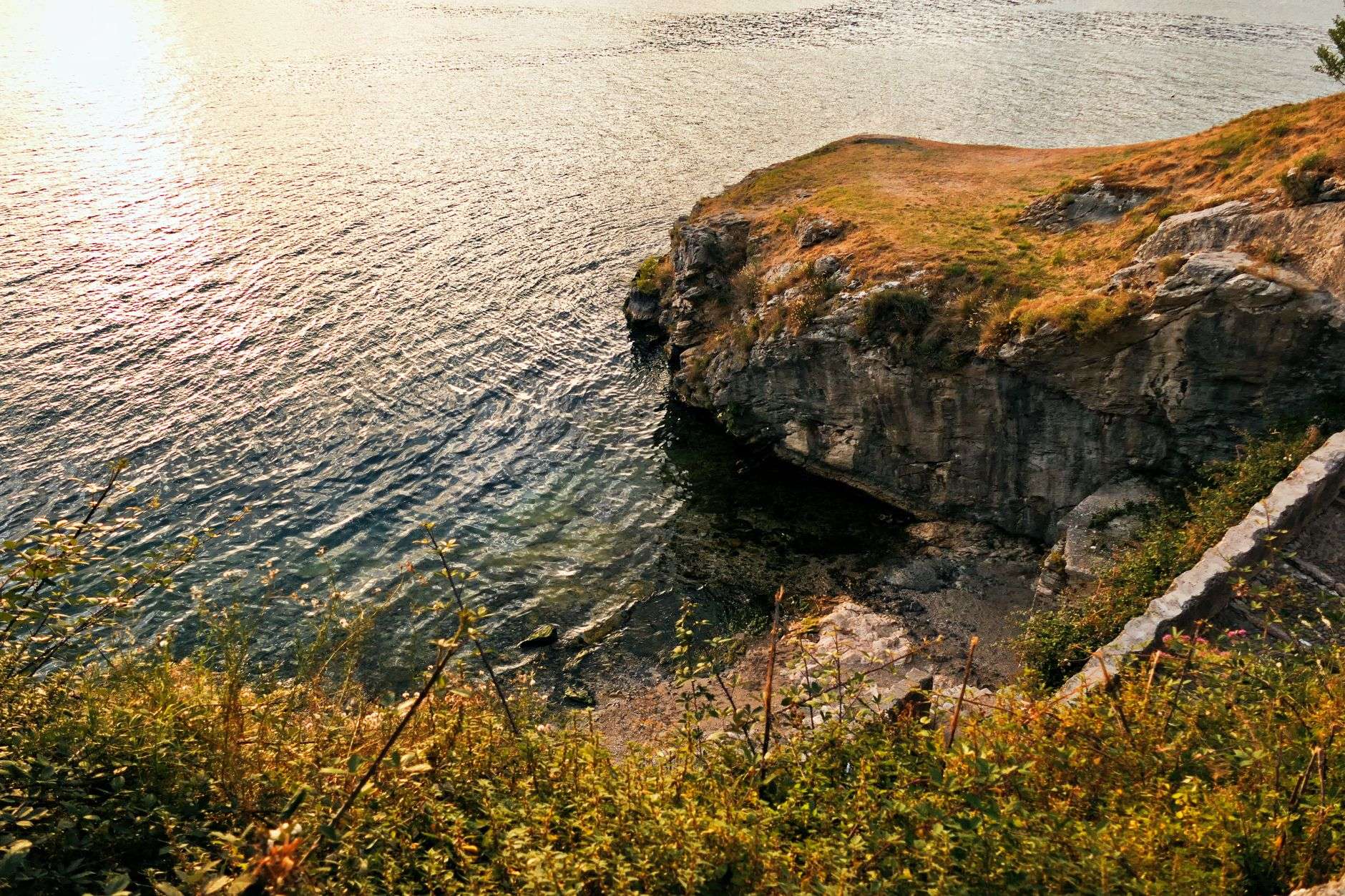 Coastal bay at sunset with calm water