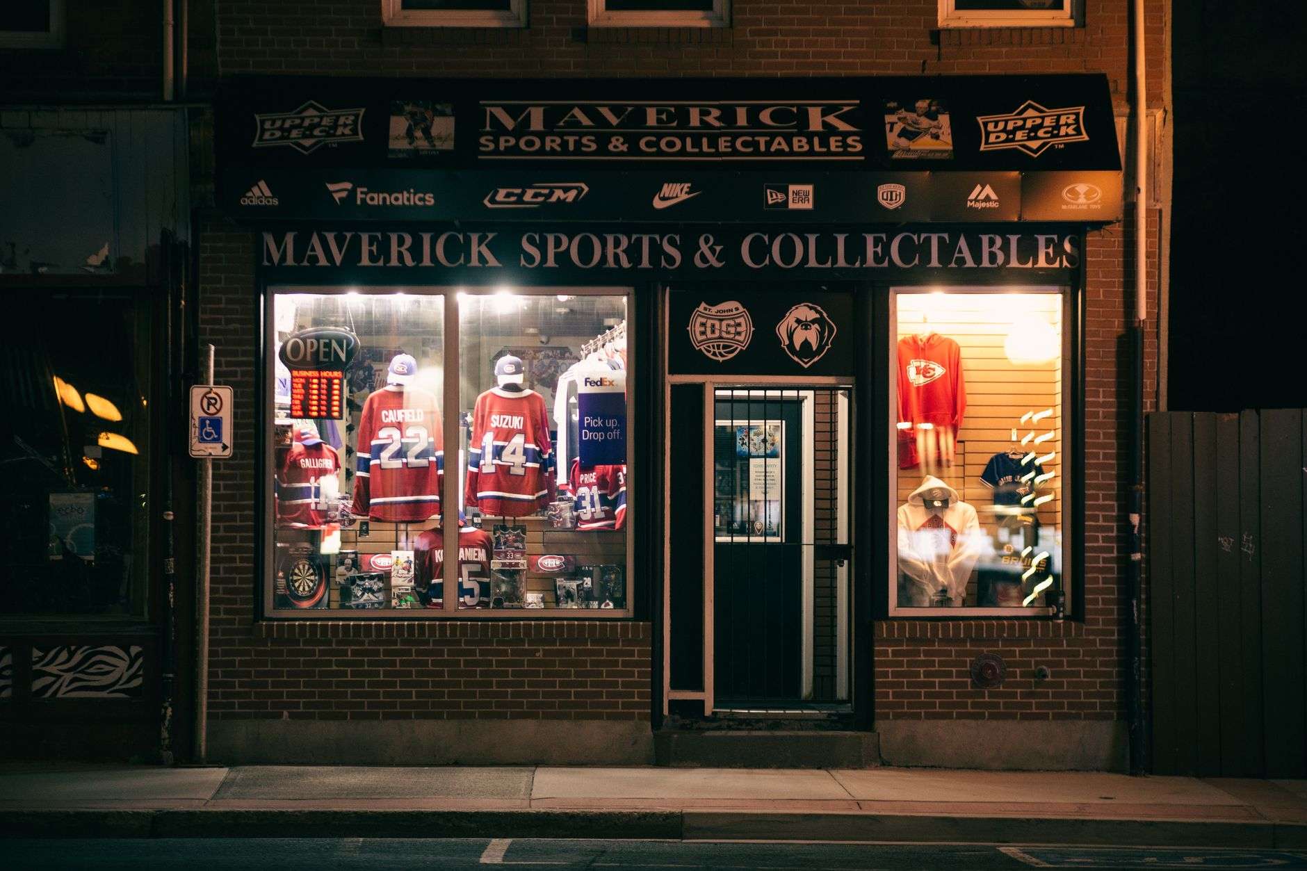 Sports memorabilia and collectibles arranged on display shelving