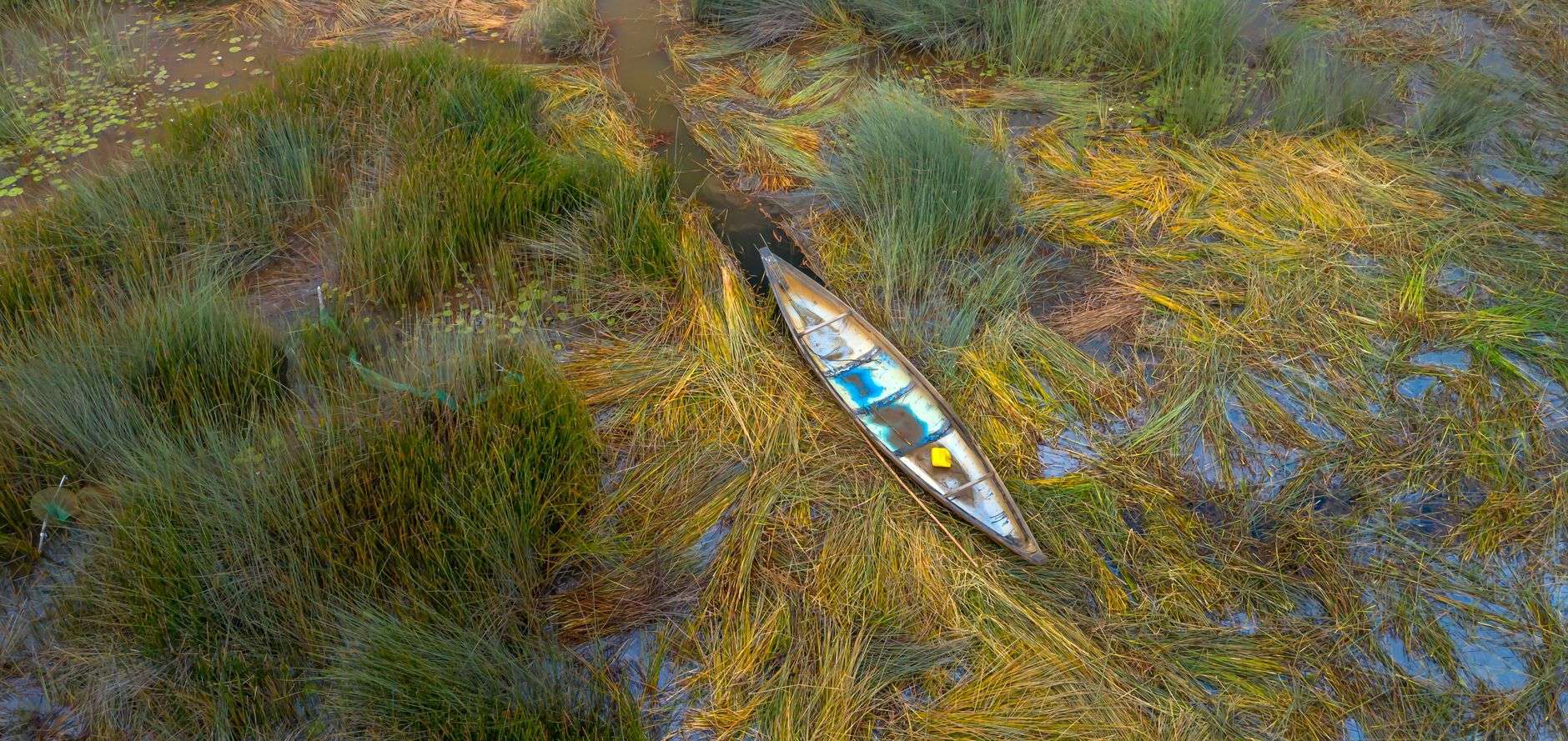 Patrol boat on a coastal marsh waterway