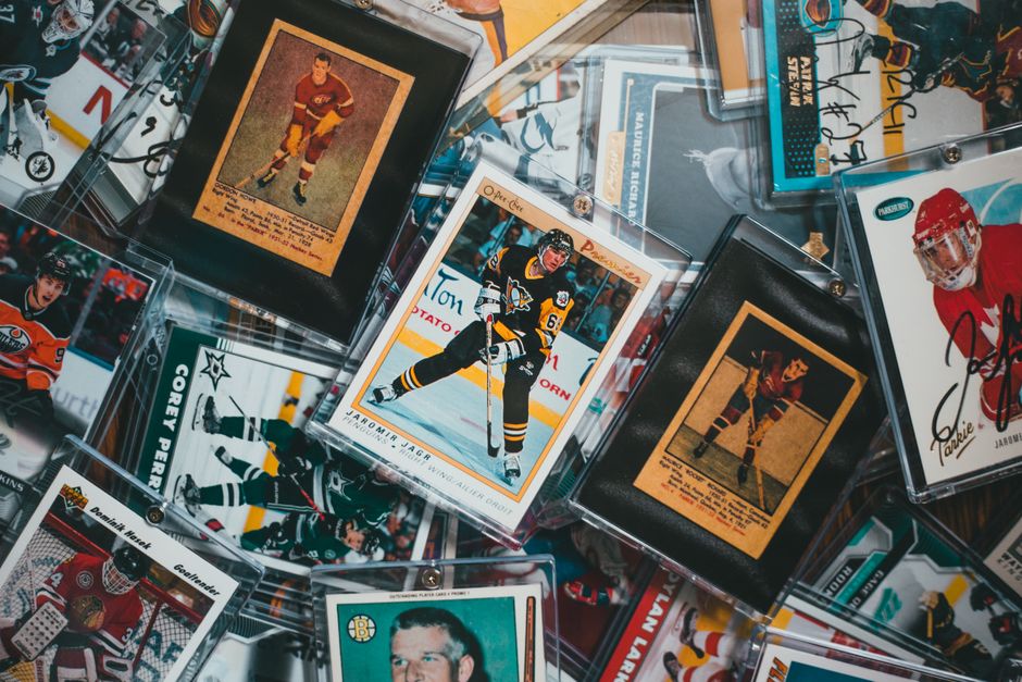 Vintage sports trading cards arranged in a protective display
