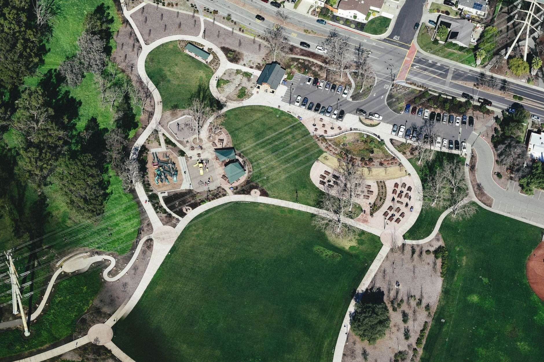 A community park with open green space and mature trees