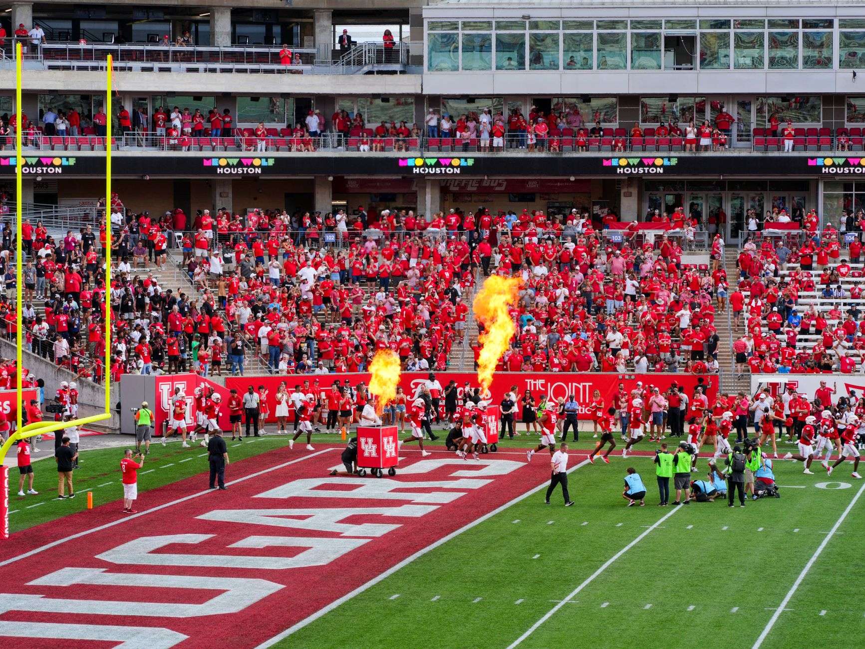 A college football stadium filled for a game day kickoff