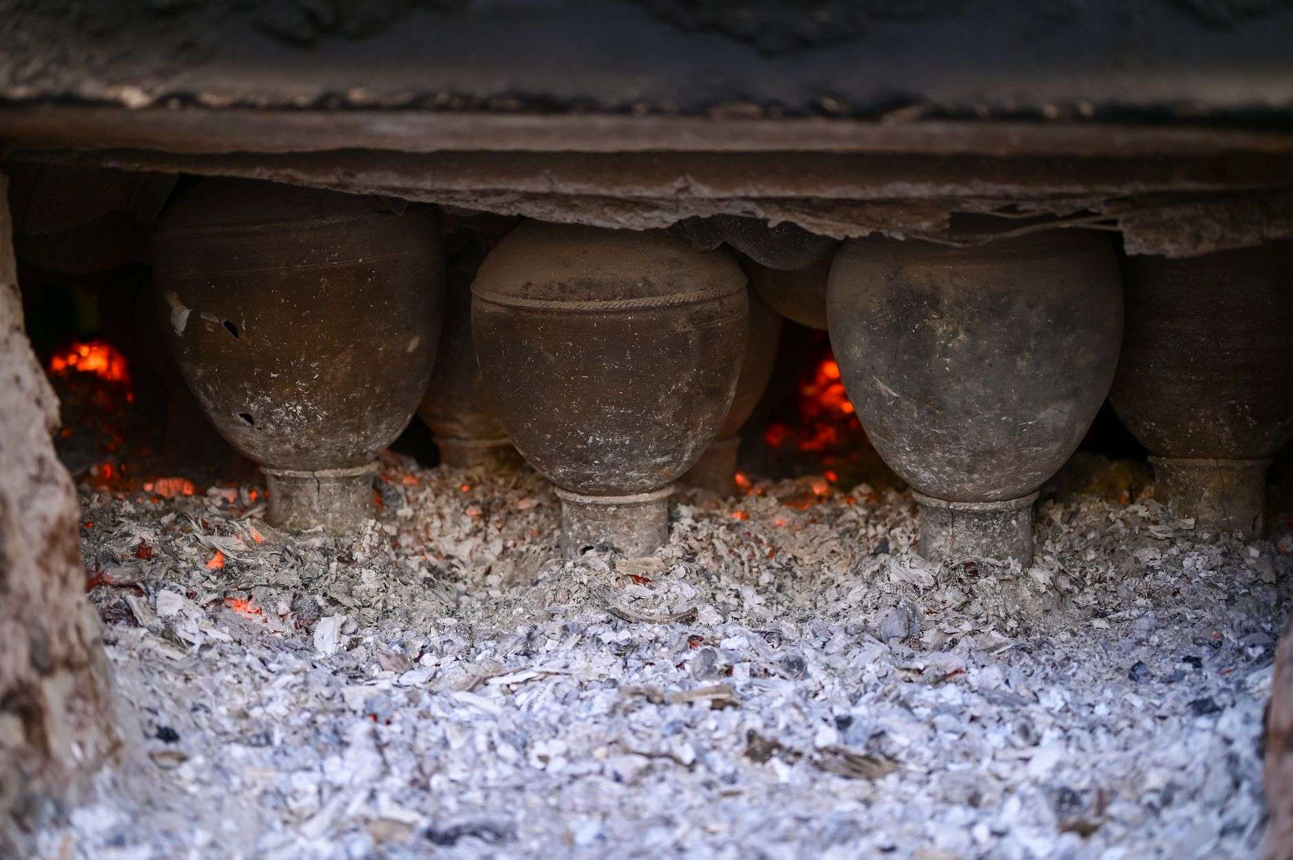 Rustic handmade ceramic vessels with natural ash glaze finishes