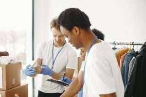 Group of young professionals gathered together for a community service meeting