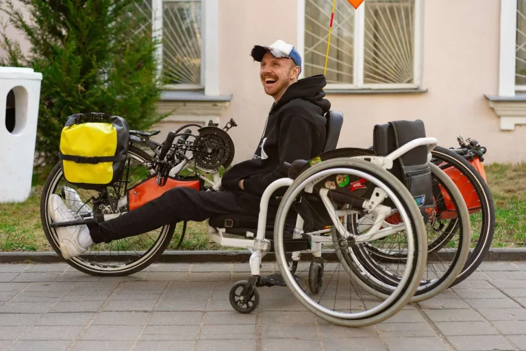Adaptive bicycle in a school gym, representing adapted physical education equipment