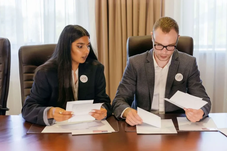 Financial documents and a pen representing campaign donations