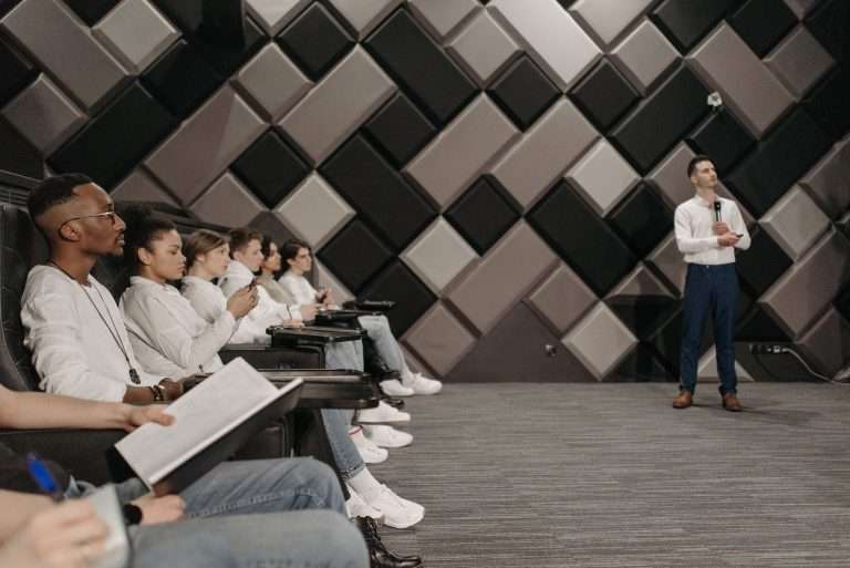 Panel of speakers addressing an audience at a professional networking forum