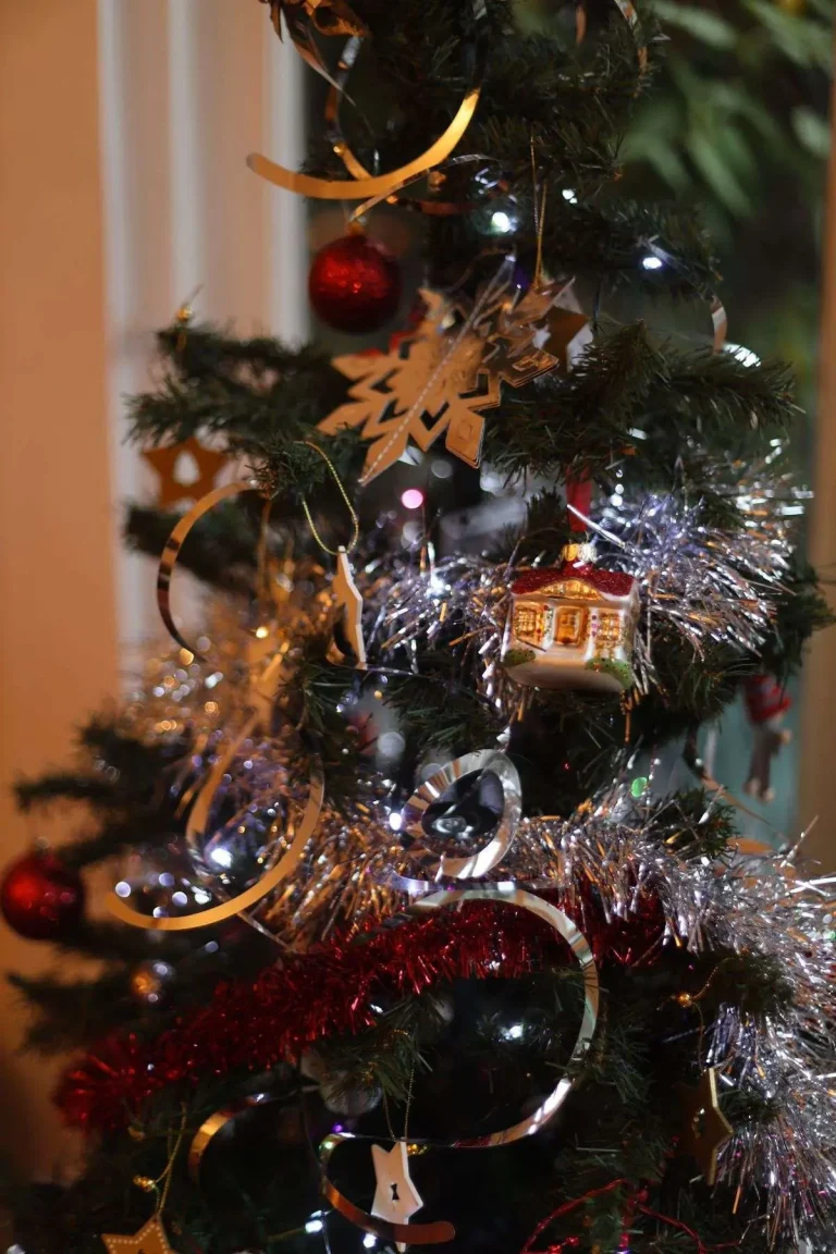 Close-up of shatterproof ornaments decorating a Christmas tree for the holiday season