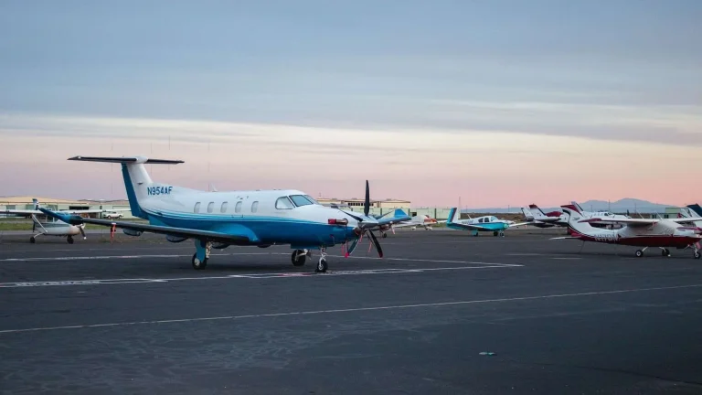 A light aircraft on the runway of a small regional airport