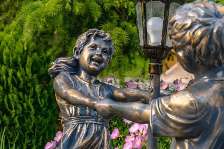 A bronze statue installed in a small city park, similar to Foley's new public art piece