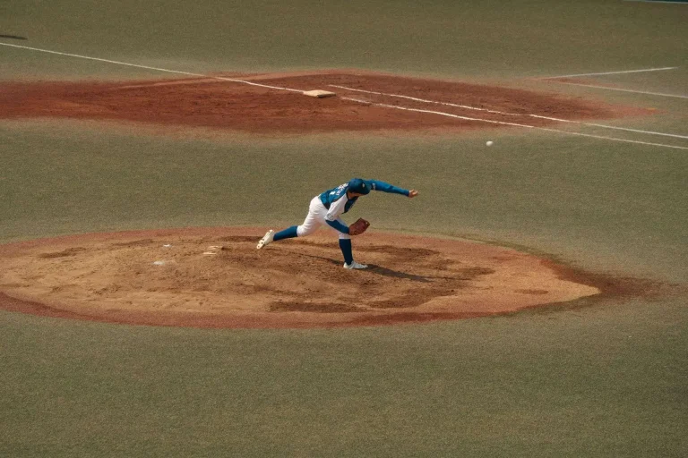 A baseball resting on a pitcher's mound at an empty ballpark