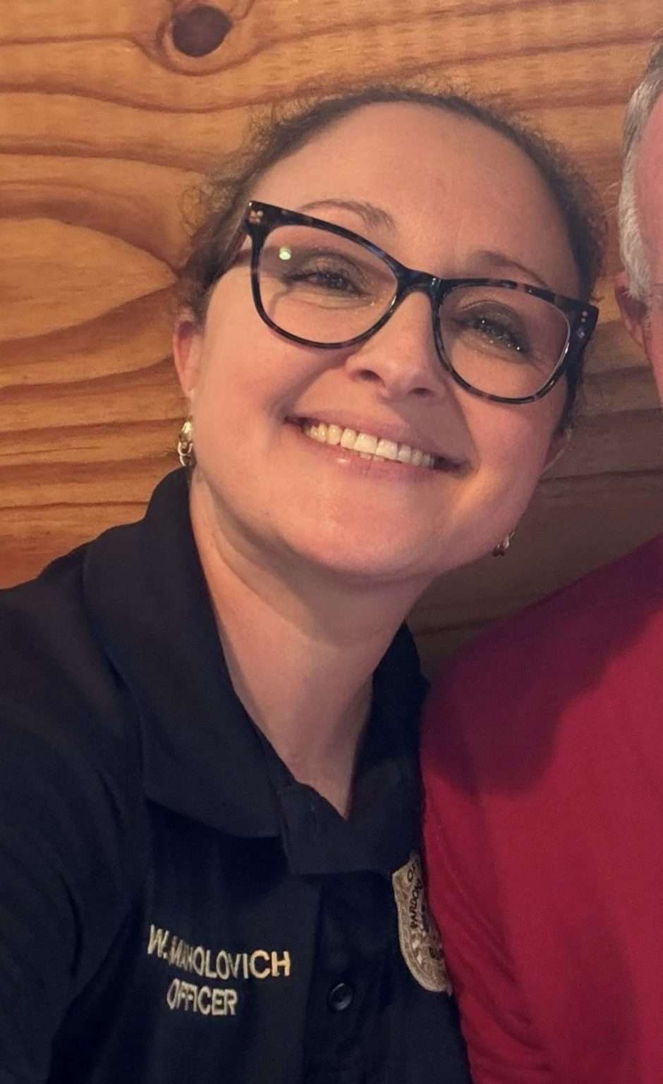 Whitney Maholovich, Alabama Board of Pardons and Paroles officer, in a black polo embroidered with her name and the word Officer
