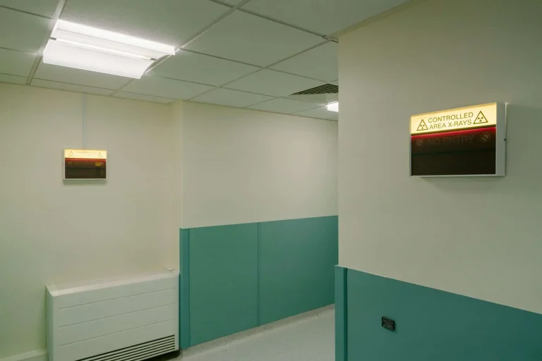 A hospital corridor with x-ray films on a lightbox