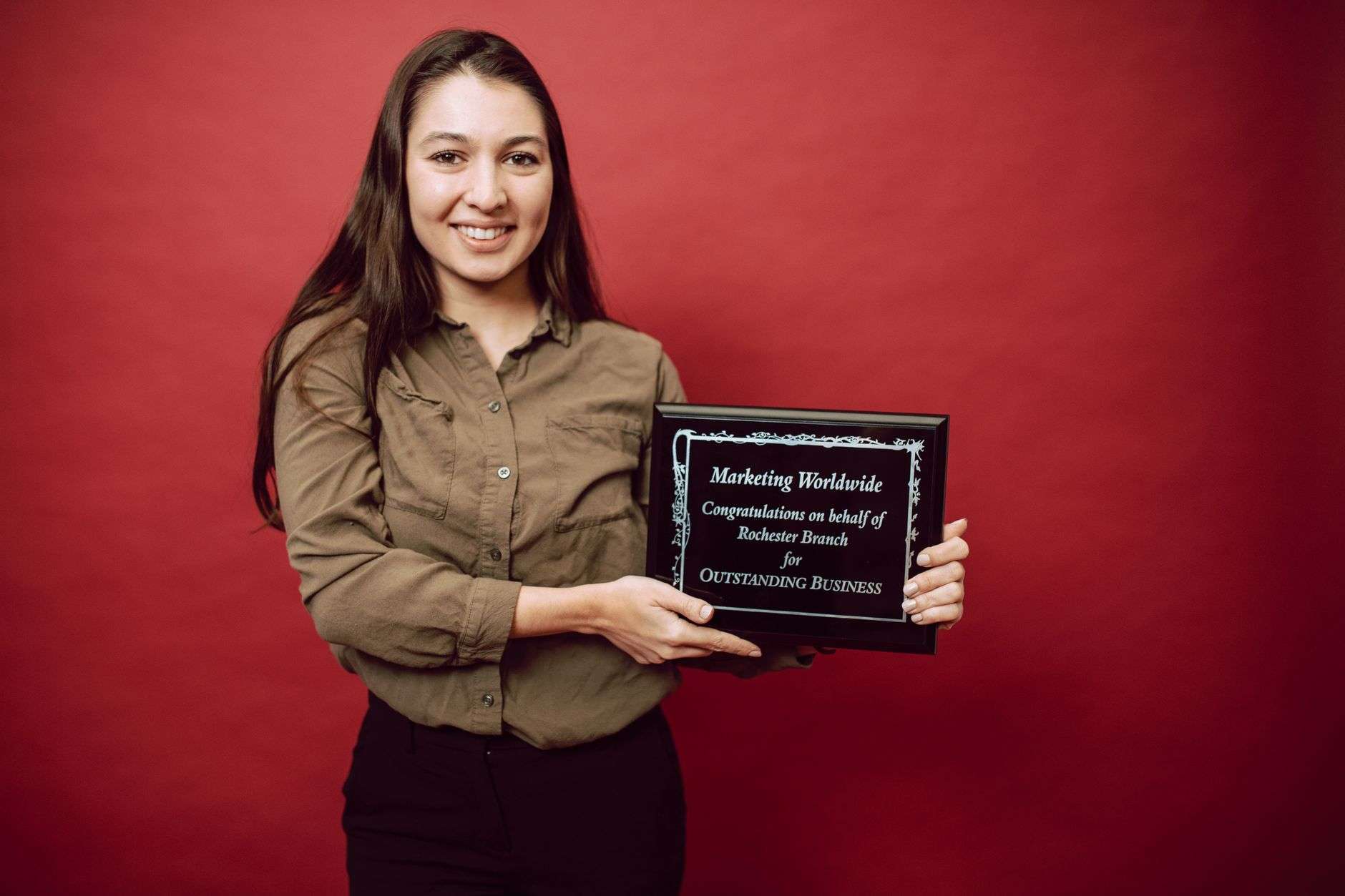 Award plaque presented at a ceremony, representing Pamela Battiste's Board Member of the Year recognition