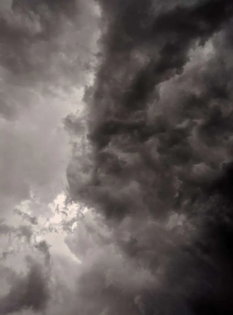 Dark, intense storm clouds filling the sky ahead of severe weather