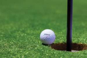 Golf flag on a green at a charity golf tournament