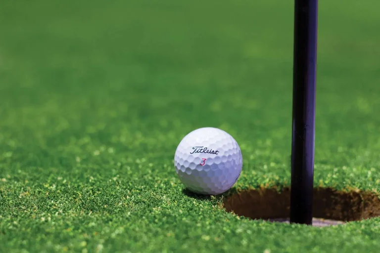 Golf flag on a green at a charity golf tournament